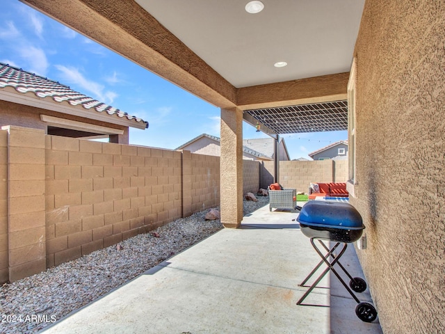 view of patio featuring a fenced backyard and grilling area