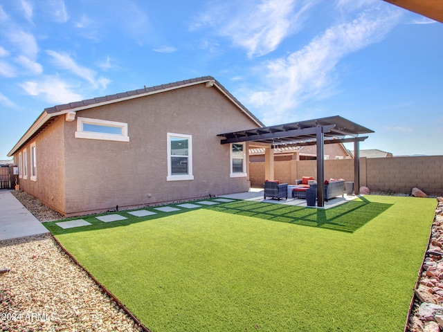 rear view of house with outdoor lounge area, a patio, a lawn, and a pergola