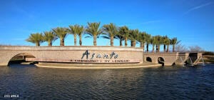 community sign with a water view