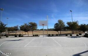 view of parking with community basketball court