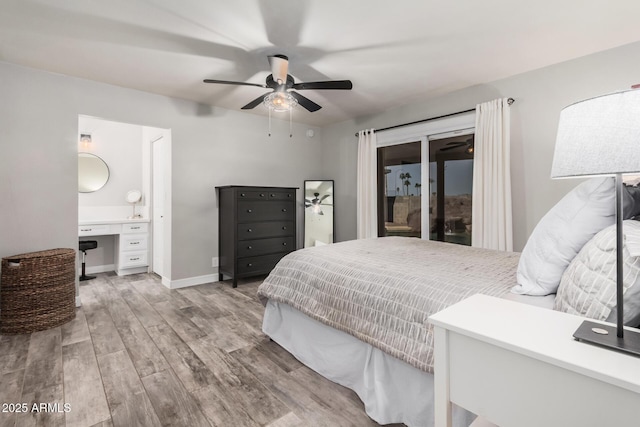 bedroom with a ceiling fan, wood finished floors, baseboards, access to exterior, and built in desk