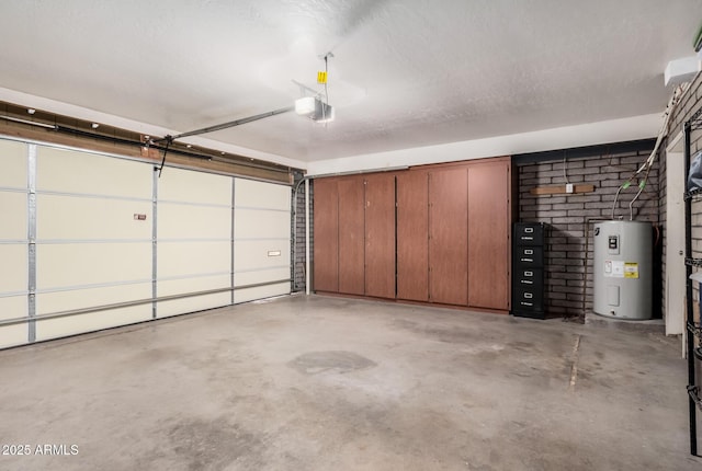 garage featuring electric water heater and a garage door opener