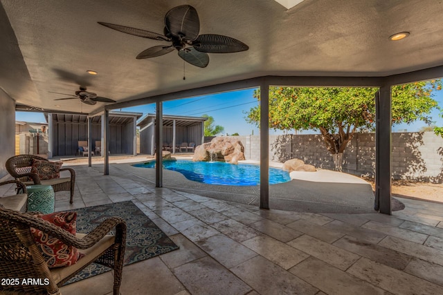 exterior space with a patio, a fenced backyard, a fenced in pool, and ceiling fan