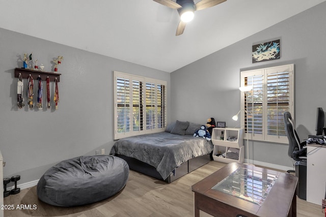 15011 N 45th Pl, Phoenix, AZ 85032 - bedroom featuring multiple windows, vaulted ceiling, ceiling fan, and light wood-type flooring