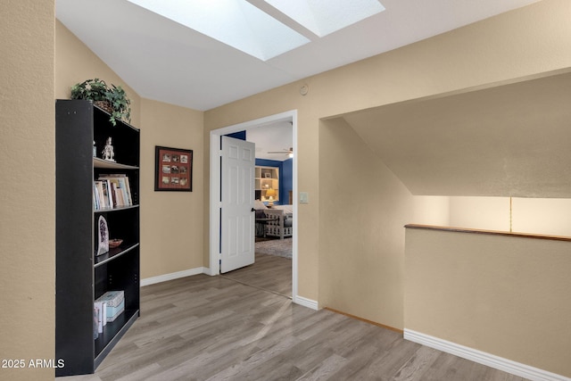 15011 N 45th Pl, Phoenix, AZ 85032 - hallway with lofted ceiling with skylight and light hardwood / wood-style floors