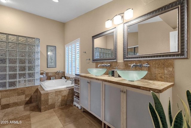 15011 N 45th Pl, Phoenix, AZ 85032 - bathroom with vanity, a relaxing tiled tub, backsplash, and tile patterned floors