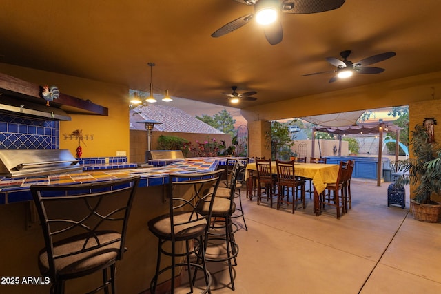 15011 N 45th Pl, Phoenix, AZ 85032 - view of patio / terrace featuring a hot tub, ceiling fan, an outdoor bar, and grilling area
