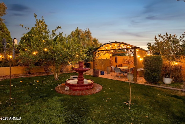 15011 N 45th Pl, Phoenix, AZ 85032 - yard at dusk with a gazebo and a patio area