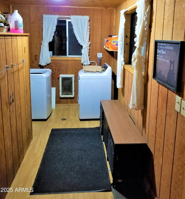 12814 E Dream Acres Ln, Parks, AZ 86018 - washroom with wood walls, wood finished floors, washing machine and clothes dryer, and heating unit