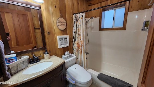 12814 E Dream Acres Ln, Parks, AZ 86018 - bathroom with vanity, toilet, shower / bath combination with curtain, and wooden walls