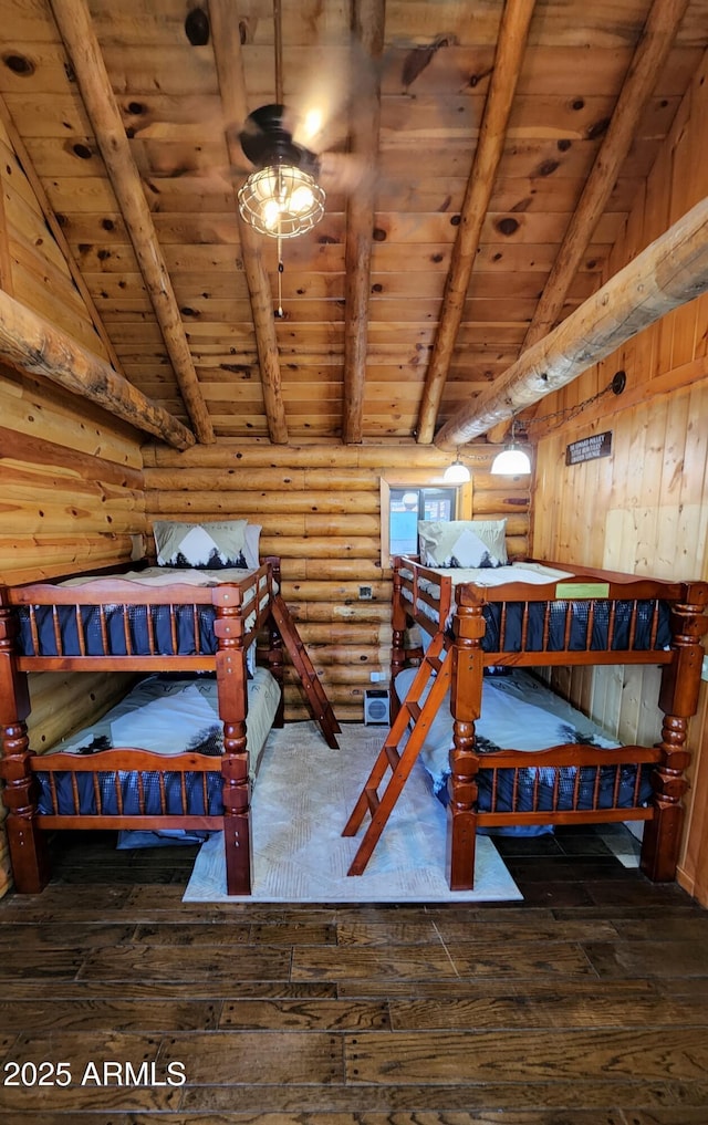 12814 E Dream Acres Ln, Parks, AZ 86018 - bedroom with wooden ceiling, hardwood / wood-style floors, and rustic walls