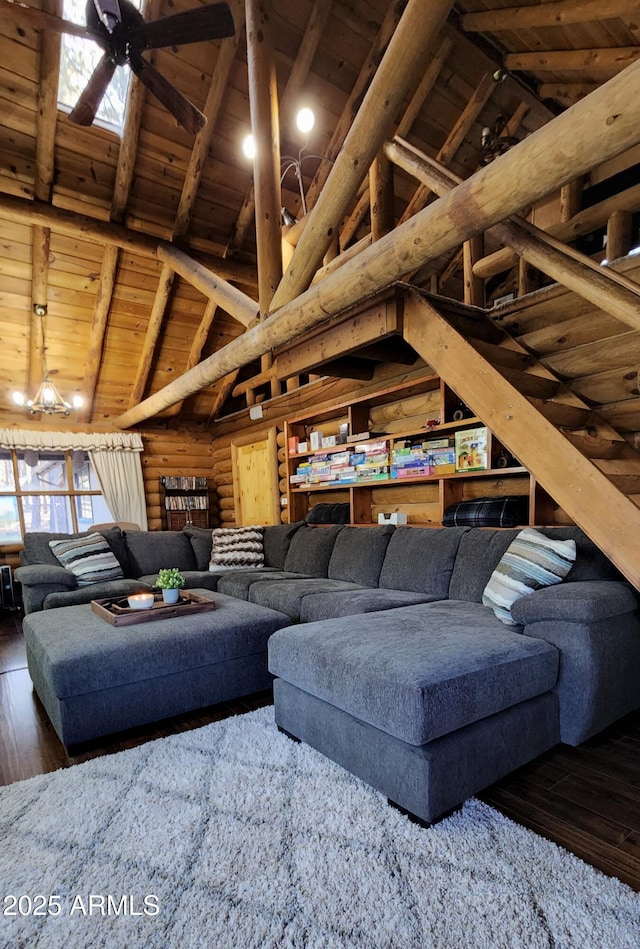 12814 E Dream Acres Ln, Parks, AZ 86018 - living area with wooden ceiling with exposed beams, hardwood / wood-style flooring, high vaulted ceiling, and log walls