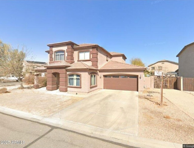 9630 E Barley Rd, Florence, AZ 85132 - mediterranean / spanish house with concrete driveway, a garage, a tile roof, and stucco siding