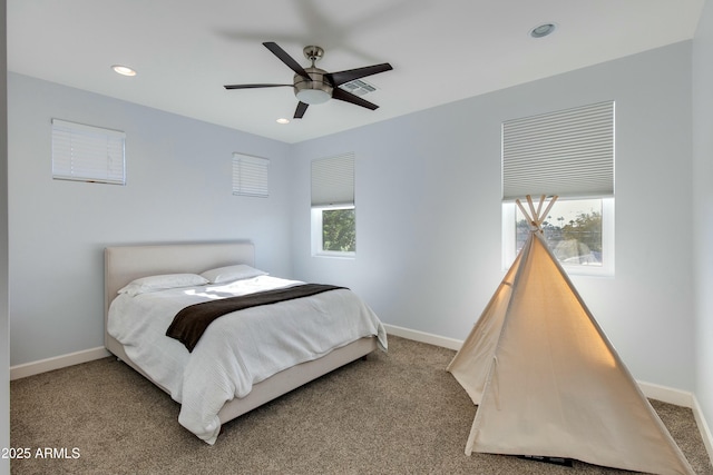 carpeted bedroom featuring ceiling fan