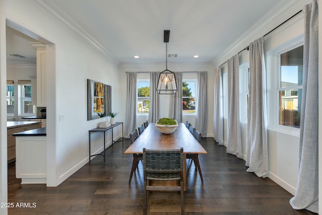 dining area with dark hardwood / wood-style flooring and ornamental molding