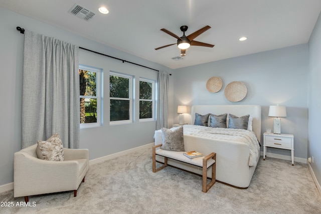 bedroom featuring ceiling fan and light carpet