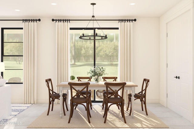 dining area featuring recessed lighting and a chandelier