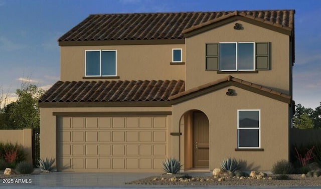 mediterranean / spanish-style home featuring a garage