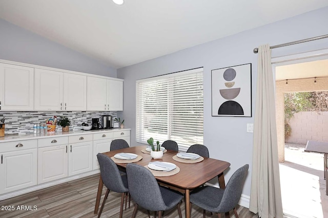 4609 E Monte Cristo Ave, Phoenix, AZ 85032 - dining space with vaulted ceiling and light wood-style flooring