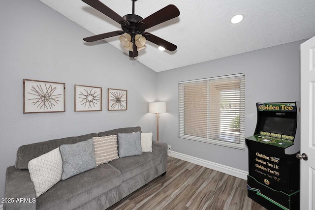 4609 E Monte Cristo Ave, Phoenix, AZ 85032 - living room featuring lofted ceiling, wood finished floors, a ceiling fan, and baseboards