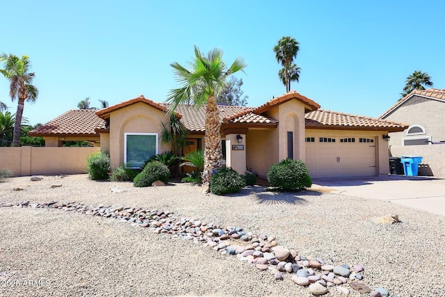 4609 E Monte Cristo Ave, Phoenix, AZ 85032 - mediterranean / spanish-style home with stucco siding, a garage, fence, and a tiled roof