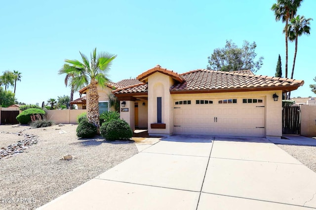 4609 E Monte Cristo Ave, Phoenix, AZ 85032 - mediterranean / spanish house featuring a garage, stucco siding, driveway, a tiled roof, and fence