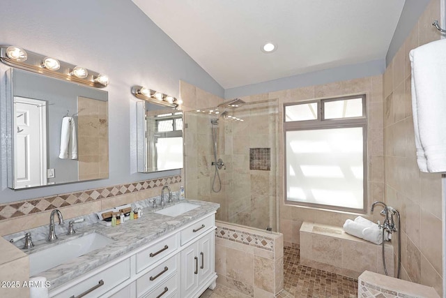 4609 E Monte Cristo Ave, Phoenix, AZ 85032 - bathroom featuring lofted ceiling, a walk in shower, double vanity, tile patterned flooring, and tile walls