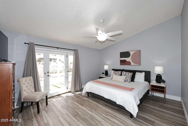 4609 E Monte Cristo Ave, Phoenix, AZ 85032 - bedroom featuring access to exterior, a textured ceiling, lofted ceiling, french doors, and wood finished floors