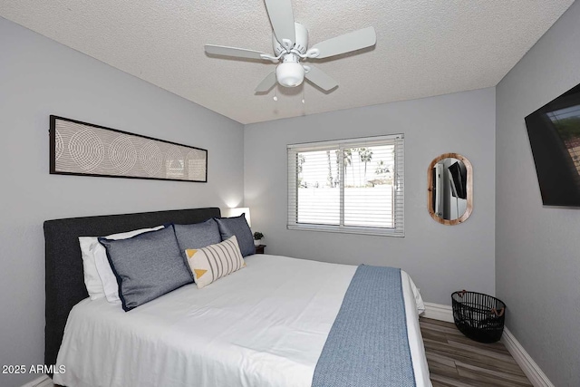4609 E Monte Cristo Ave, Phoenix, AZ 85032 - bedroom featuring wood finished floors, a textured ceiling, baseboards, and ceiling fan