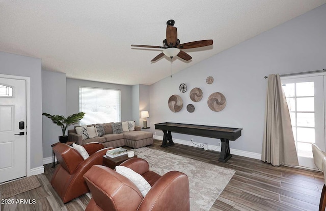 4609 E Monte Cristo Ave, Phoenix, AZ 85032 - living area featuring ceiling fan, wood finished floors, a textured ceiling, baseboards, and lofted ceiling