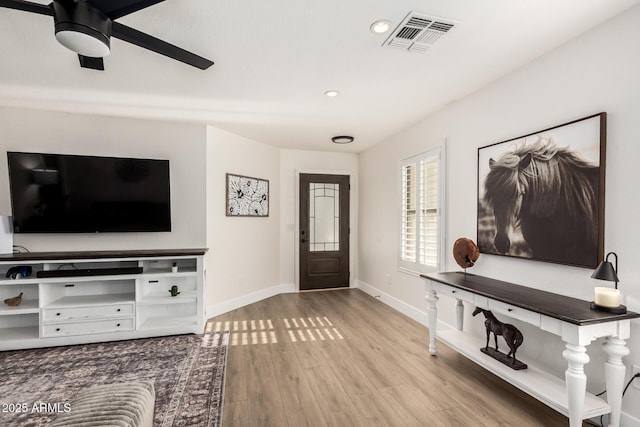 foyer entrance featuring recessed lighting, visible vents, ceiling fan, wood finished floors, and baseboards