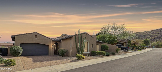 25995 N 85th Dr, Peoria, AZ 85383 - view of front facade featuring a garage, driveway, stucco siding, and a tile roof