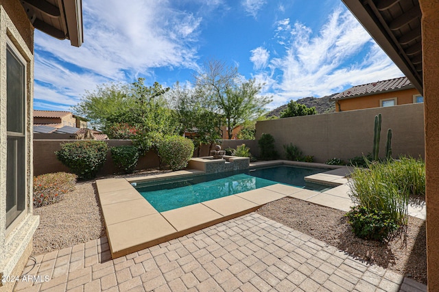 view of swimming pool featuring a patio