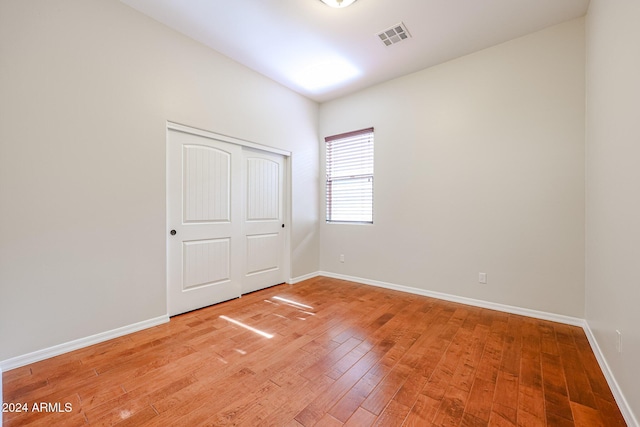 25995 N 85th Dr, Peoria, AZ 85383 - unfurnished bedroom featuring light wood finished floors, baseboards, and a closet