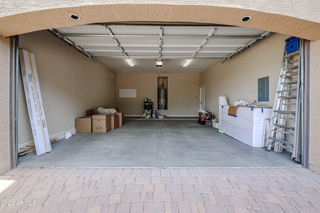 garage with electric panel, gas water heater, and a garage door opener