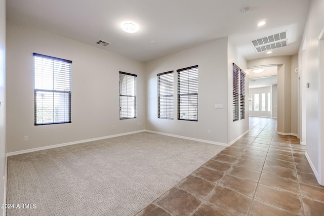 25995 N 85th Dr, Peoria, AZ 85383 - unfurnished room featuring baseboards, carpet, a smoke detector, tile patterned floors, and recessed lighting
