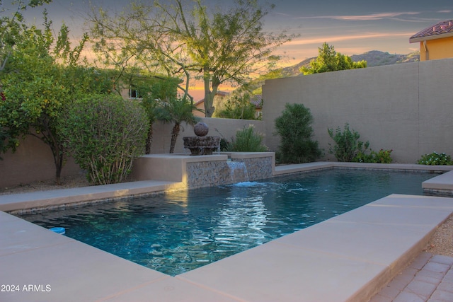 25995 N 85th Dr, Peoria, AZ 85383 - pool at dusk with a fenced backyard