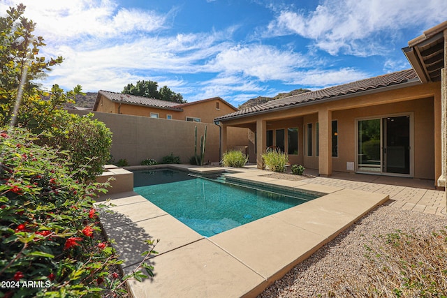 view of swimming pool featuring a patio area