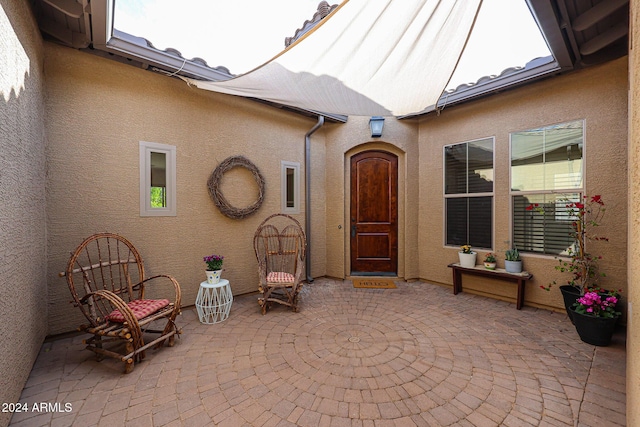 25995 N 85th Dr, Peoria, AZ 85383 - entrance to property with a patio and stucco siding