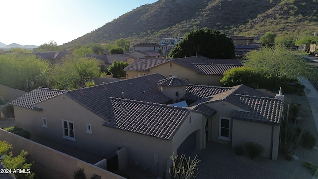 birds eye view of property featuring a mountain view