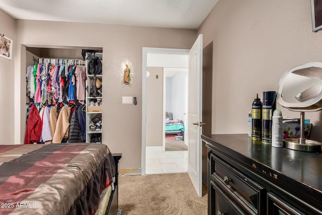 carpeted bedroom with a closet