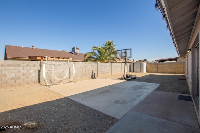 view of patio / terrace with a shed