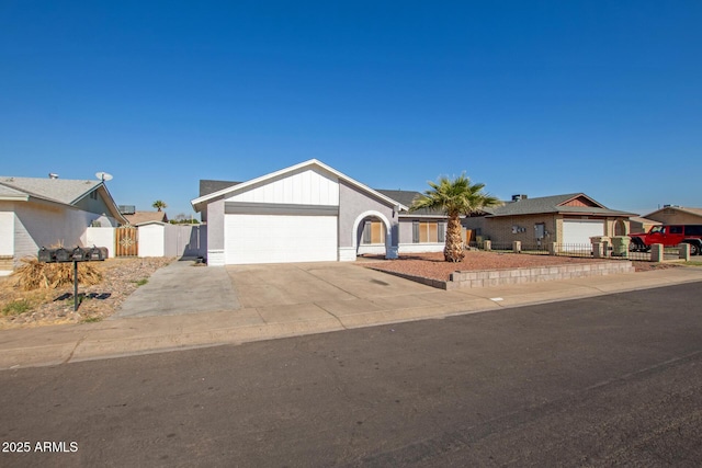 ranch-style house featuring a garage and a storage shed