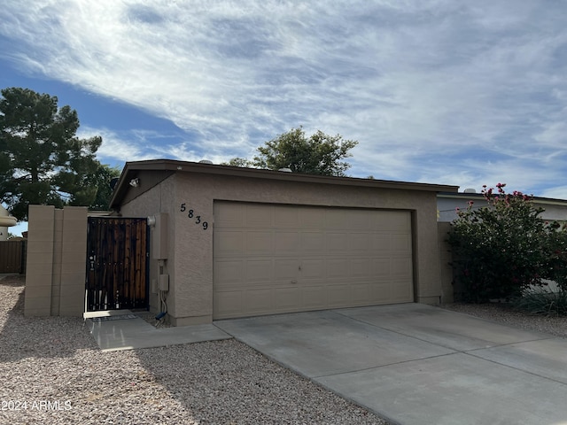 5839 E Norwood St, Mesa, AZ 85215 - garage with driveway and a gate