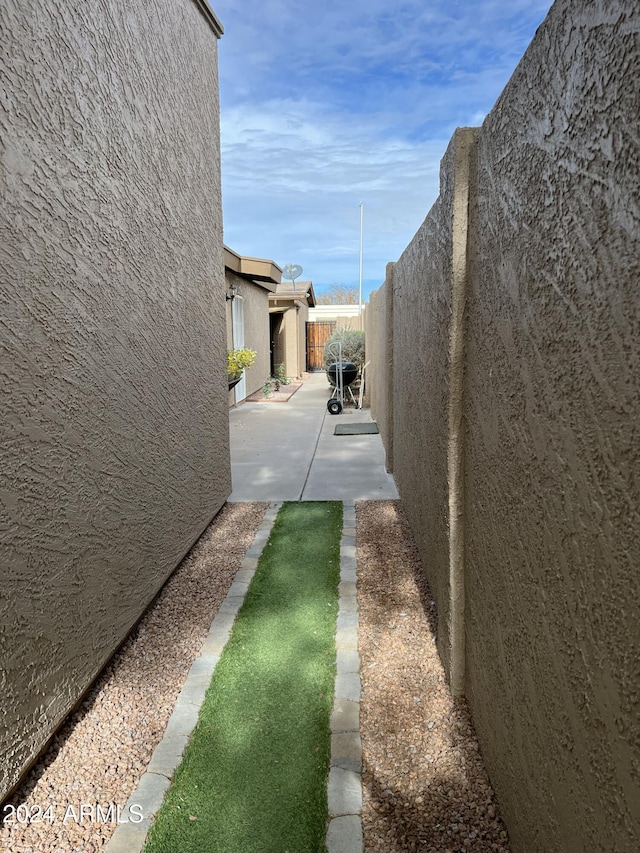 5839 E Norwood St, Mesa, AZ 85215 - view of property exterior with stucco siding, a patio, and a fenced backyard