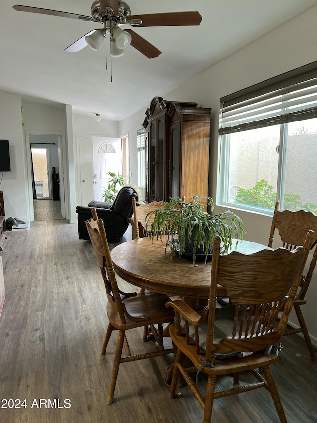 5839 E Norwood St, Mesa, AZ 85215 - dining area featuring wood finished floors, ceiling fan, and vaulted ceiling