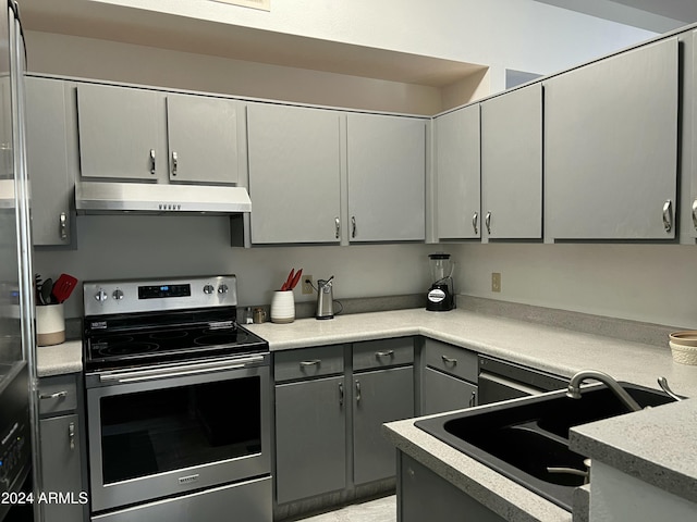 5839 E Norwood St, Mesa, AZ 85215 - kitchen with stainless steel range with electric stovetop, a sink, under cabinet range hood, gray cabinets, and light countertops