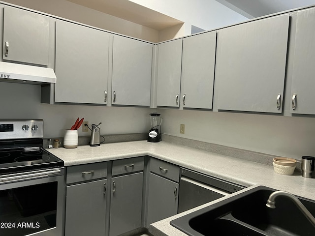 5839 E Norwood St, Mesa, AZ 85215 - kitchen featuring stainless steel range with electric stovetop, a sink, under cabinet range hood, gray cabinets, and light countertops