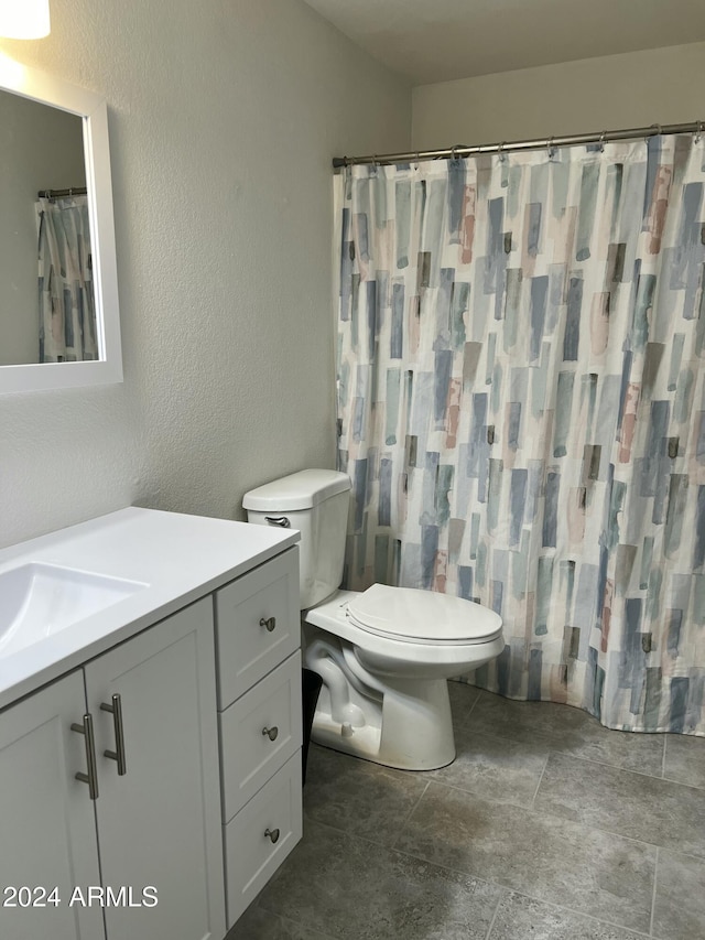 5839 E Norwood St, Mesa, AZ 85215 - full bathroom with a shower with curtain, vanity, stone finish flooring, toilet, and a textured wall