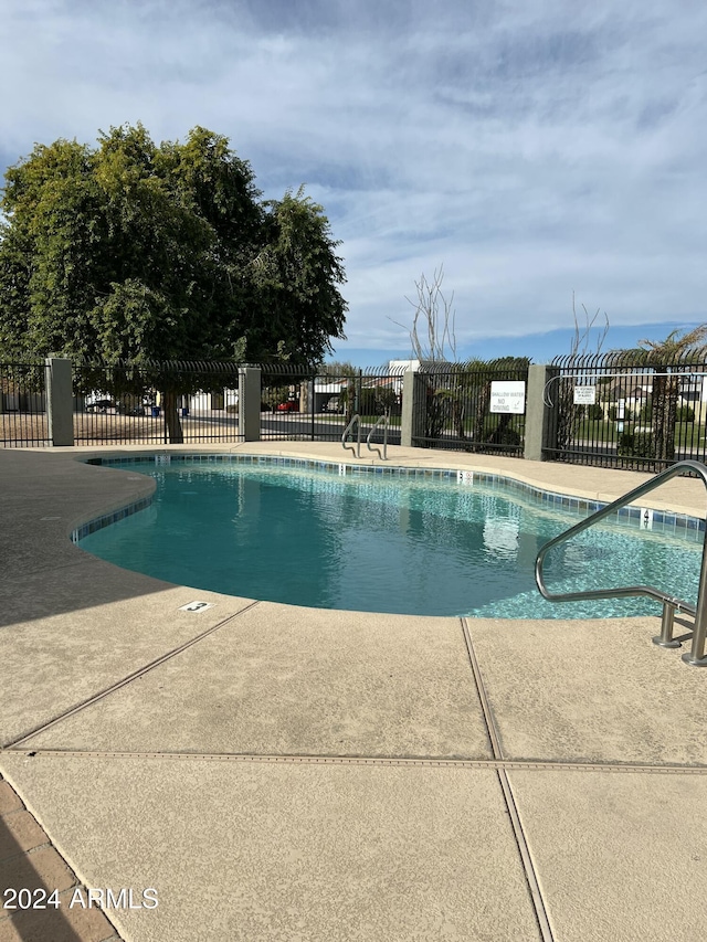 5839 E Norwood St, Mesa, AZ 85215 - community pool with fence and a patio area